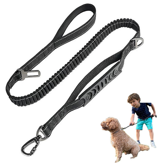 Black dog leash with metal clips on a white background, used by a child to walk a dog.