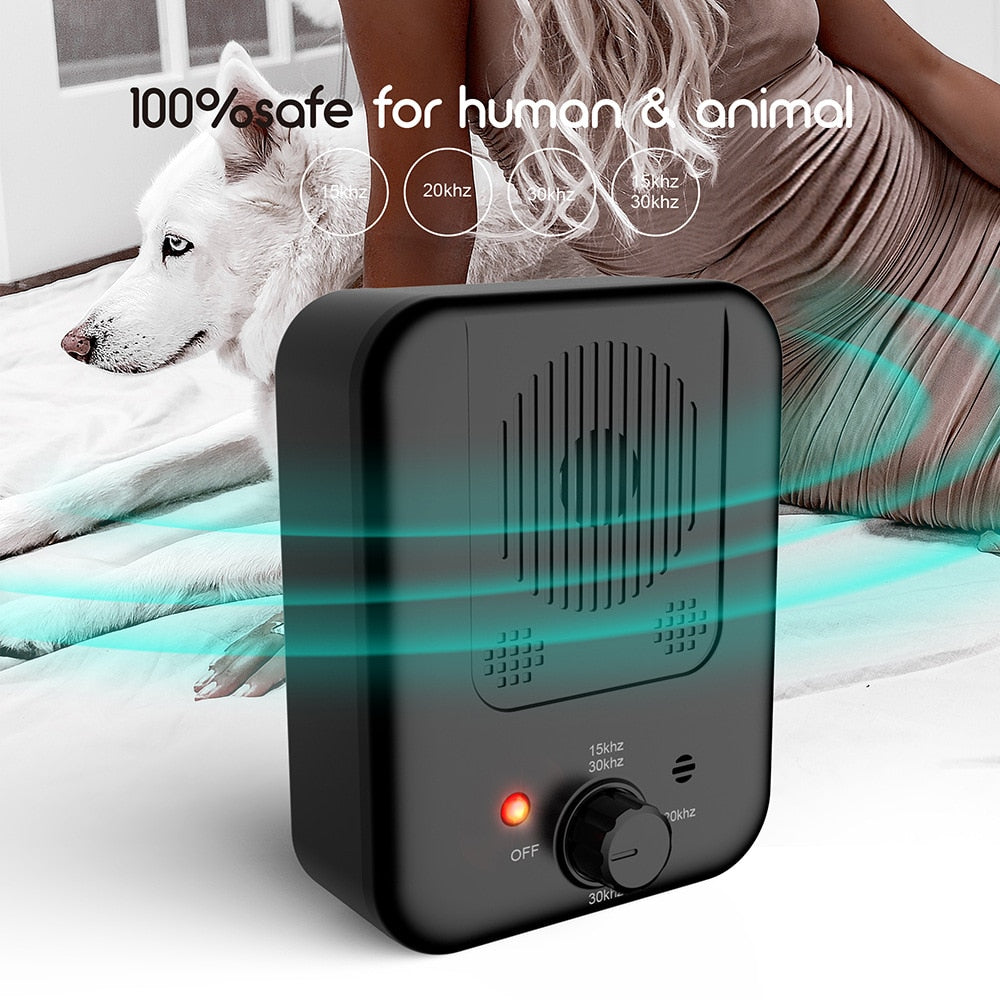 Owner using BarkLogic Ultrasonic Trainer in modern home interior