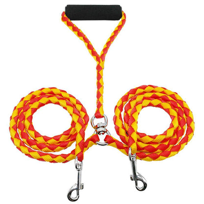 Red and yellow braided double dog leash with metal clips on a white background