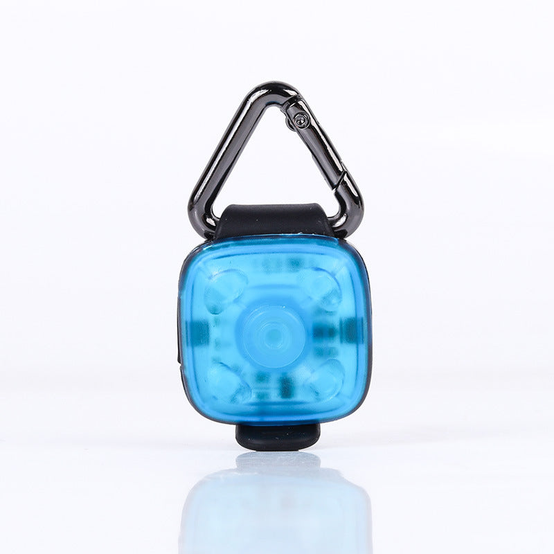 Blue LED pet safety light with carabiner on a white background