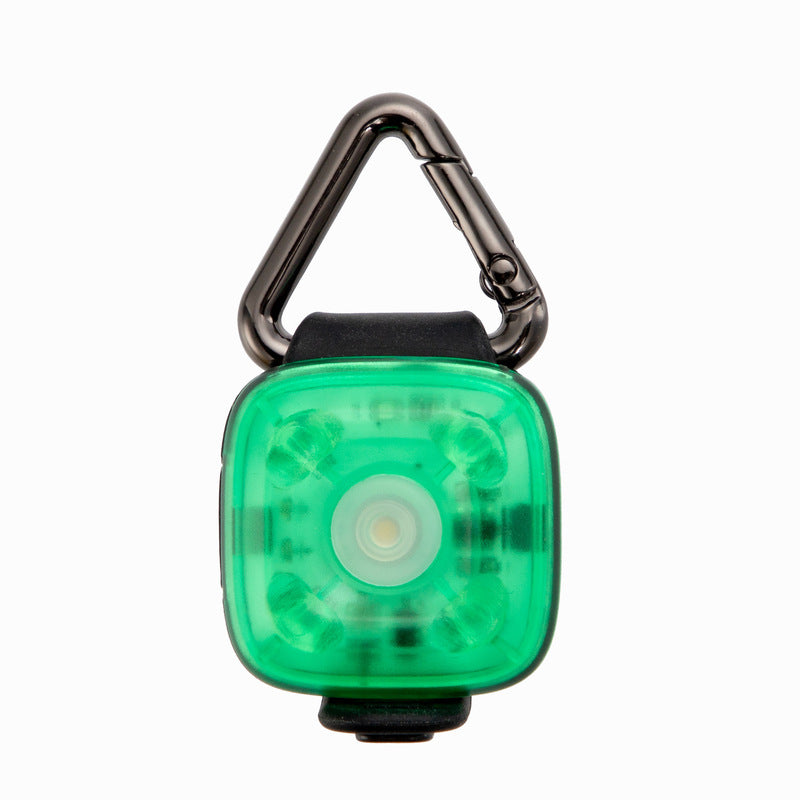 Green LED pet safety light with carabiner on a white background