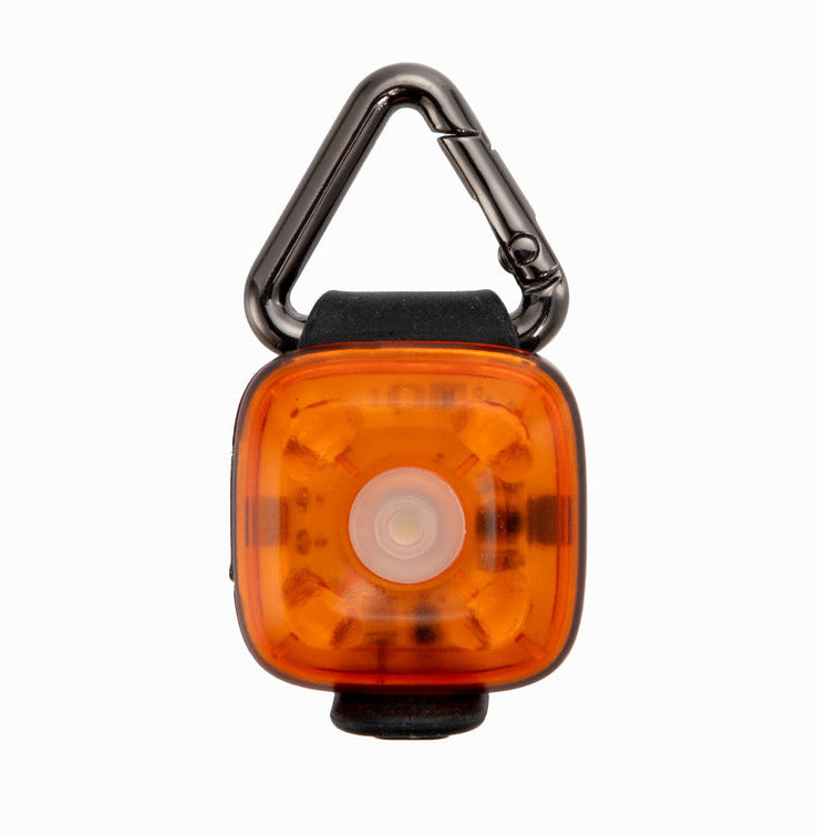 Orange LED pet safety light with a carabiner on a white background