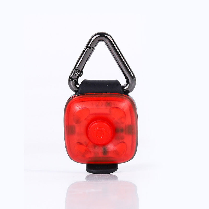 Red LED pet light with a carabiner on a white background