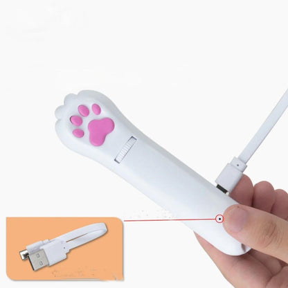 PawBeam cat laser toy connected to USB cable for charging