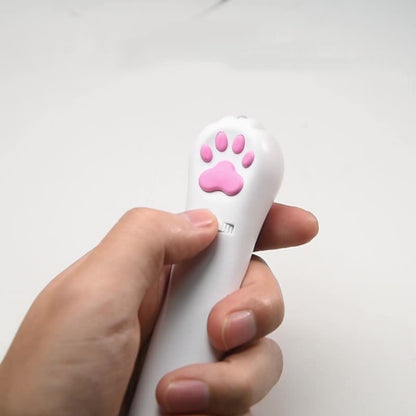Person holding PawBeam laser pointer for indoor cat play