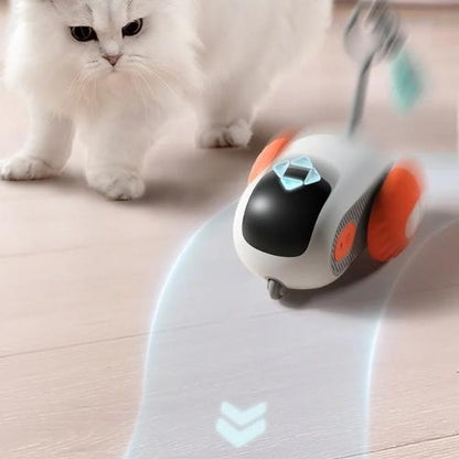 Remote-controlled smart cat toy racing along the ground with a cat playing