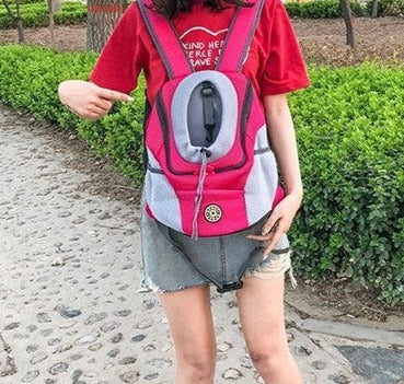 Breathable Outdoor Adventure Backpack woman holding and pointing to red backpack