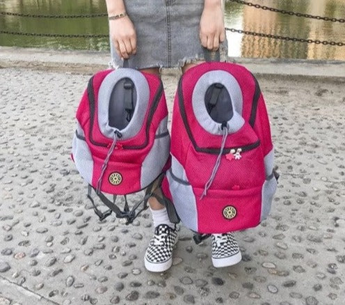 Breathable Outdoor Adventure Backpack woman holding 2 different size red backpacks